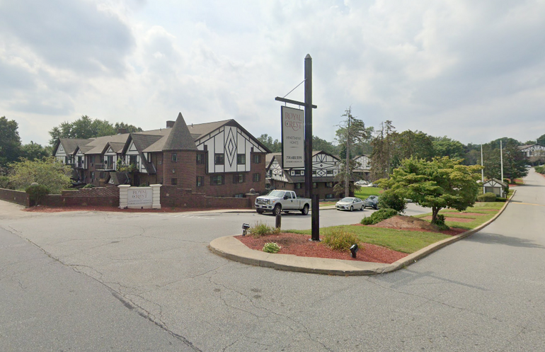 Entrance to an apartment complex with a tudor-style architecture