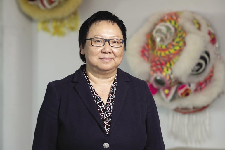 Tuyet Tran poses for a headshot at the Southeast Asian Coallition's new offices.