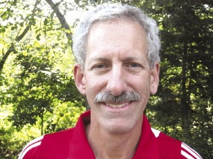 Man with gray hair and mustache