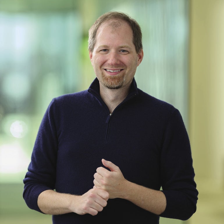 A man in a dark blue shirt