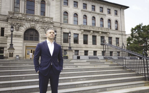 Seth Pitts looking into the distance behind Worcester City Hall