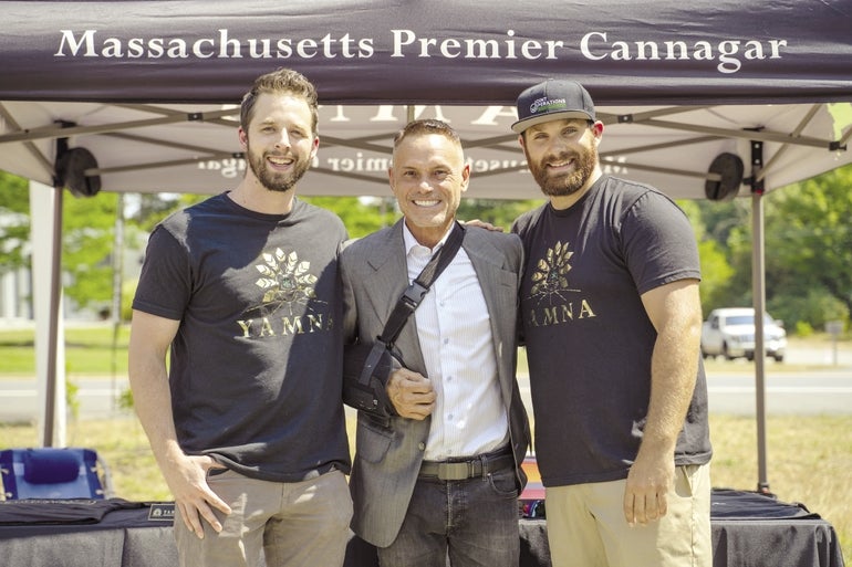 A photo of Kevin MacConnell and Tim Phillips with entrepreneur and former "Shark Tank" star Kevin Harrington.