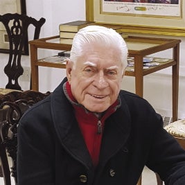 Elderly man smiles at camera