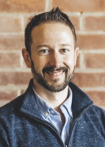 Man in pullover and dress shirt