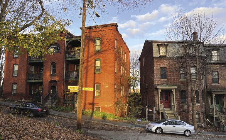 Two brick buildings side by side in Worcester's Main South neighborhood  