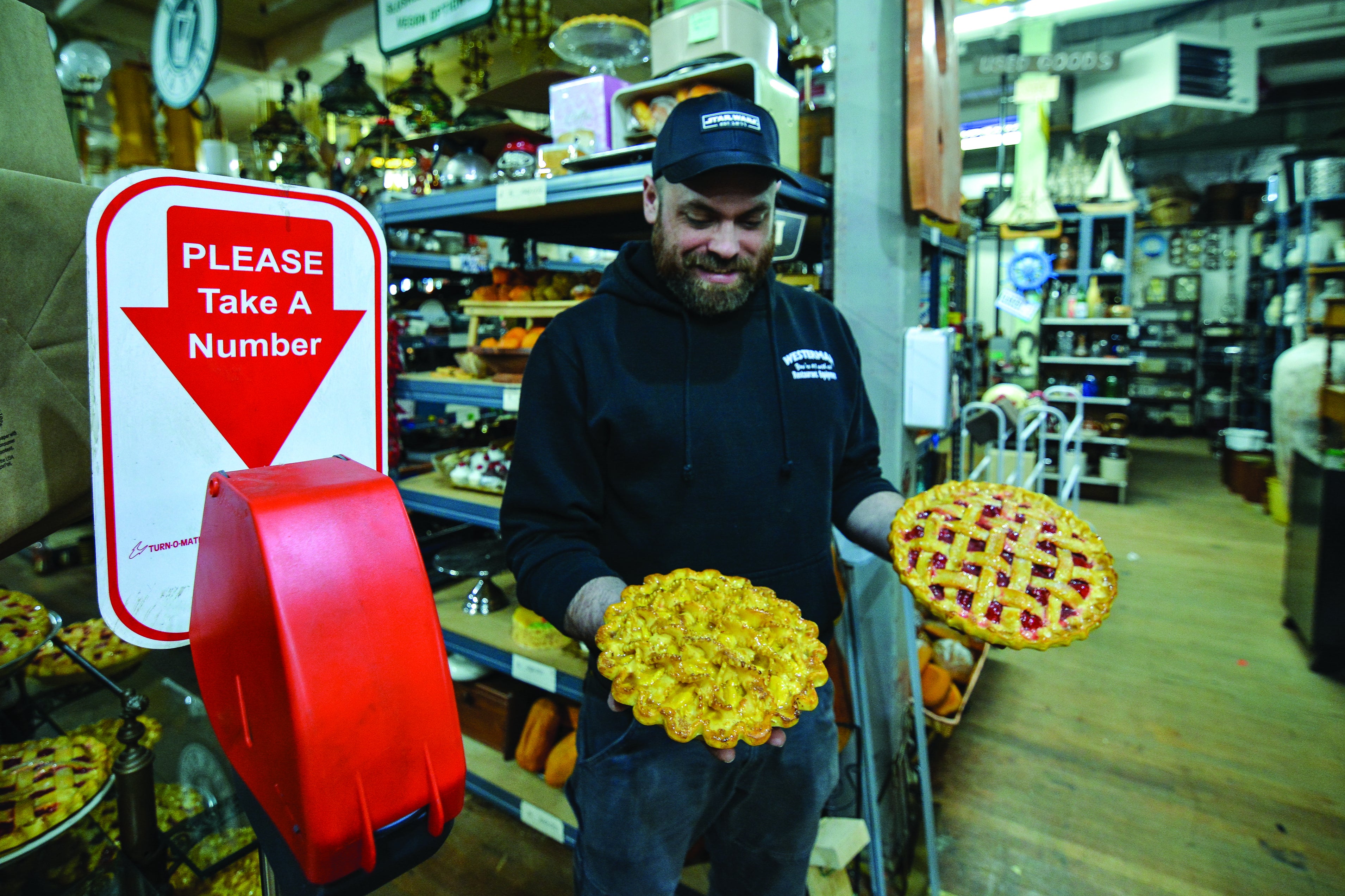 A man hold two pies 