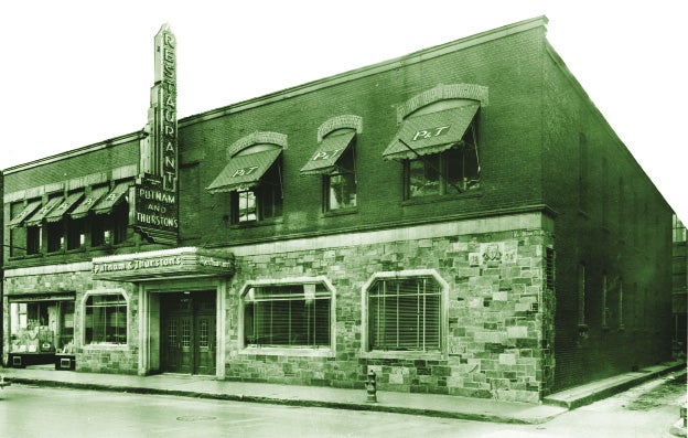 A sepia photo of the exterior of an old resturaunt