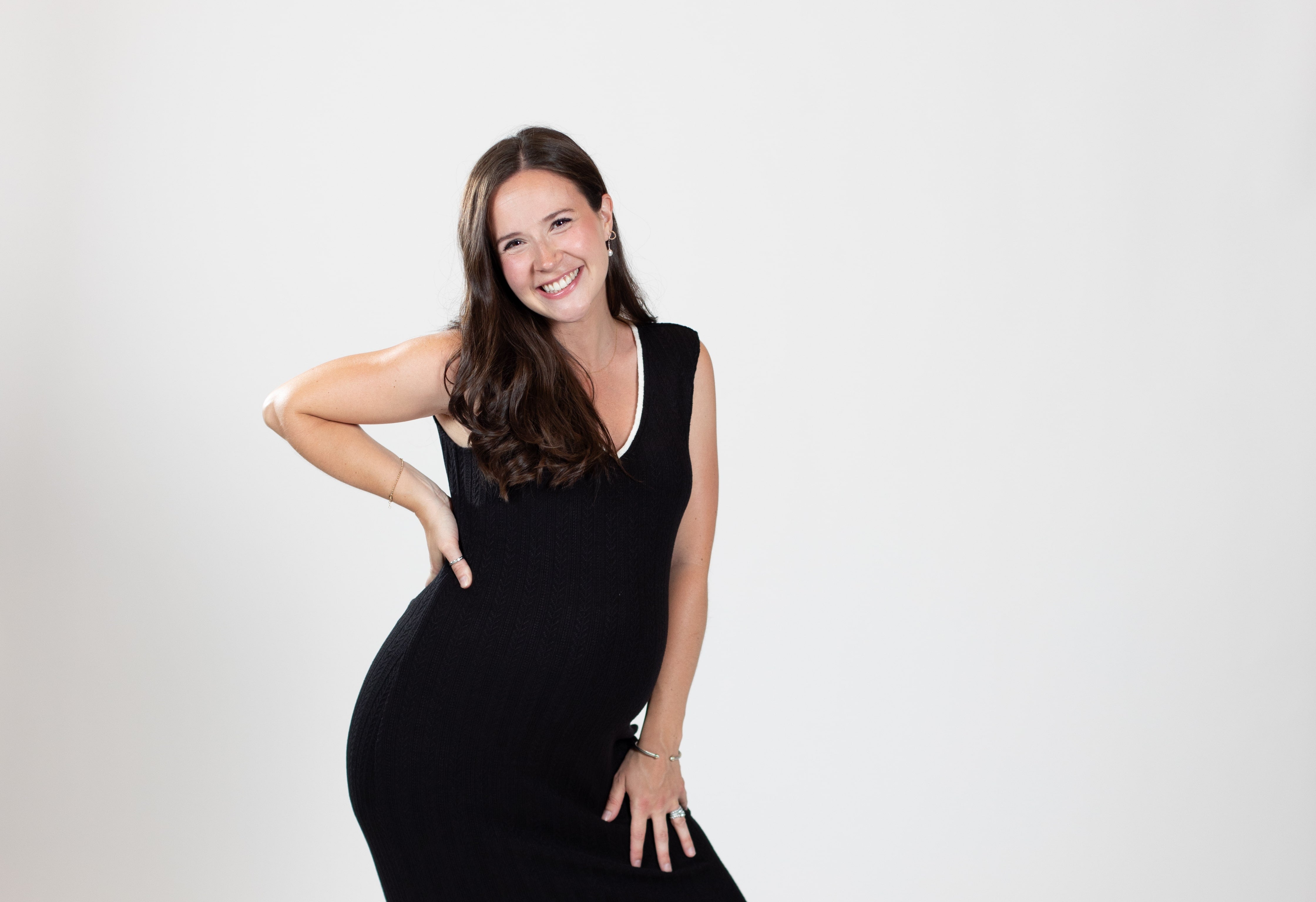 Woman wearing black dress smiles